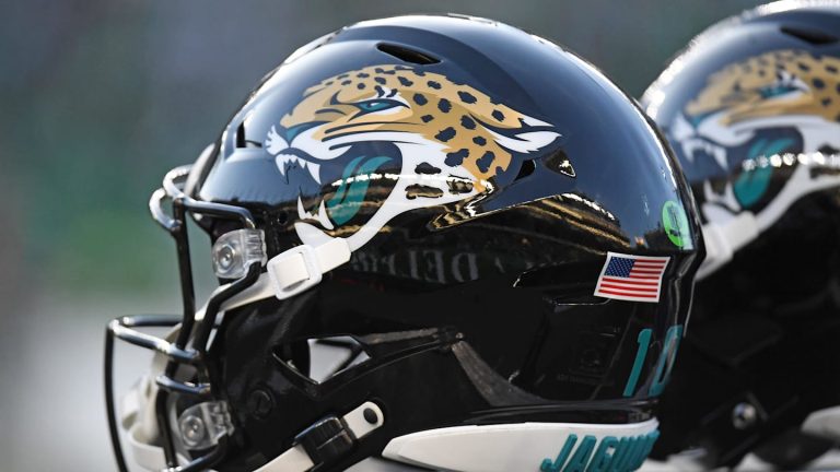 Football helmet with jaguar logo and USA flag.