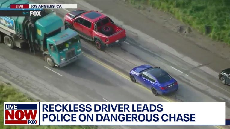 Aerial view of high-speed police chase on highway.