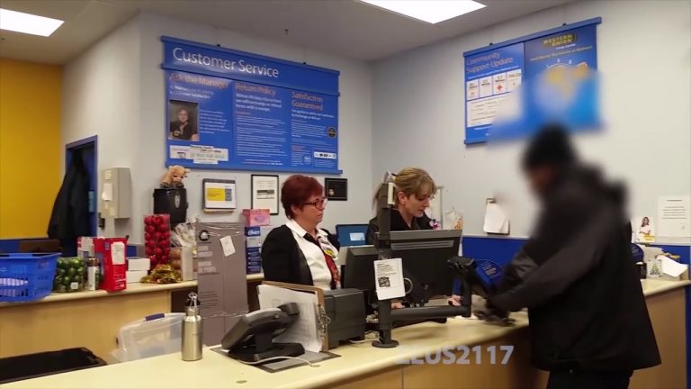 Customer service desk with staff and customer.