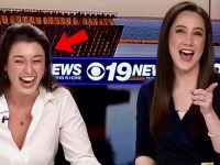 Two news anchors laughing on air.