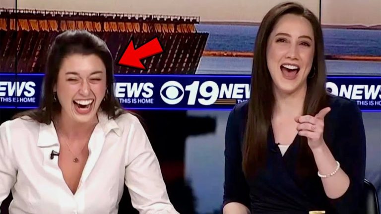 Two news anchors laughing on air.