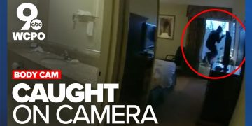 Body cam footage shows suspect jumping through window.