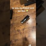 Broken keyboard on wooden floor with caption overlay.