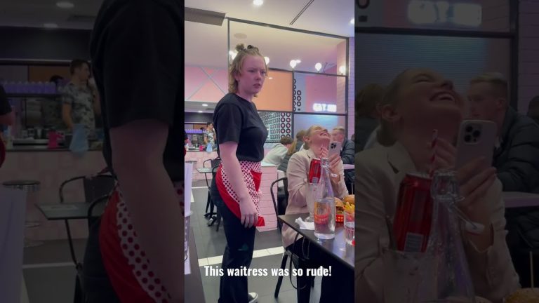 Waitress looking annoyed in a crowded restaurant.