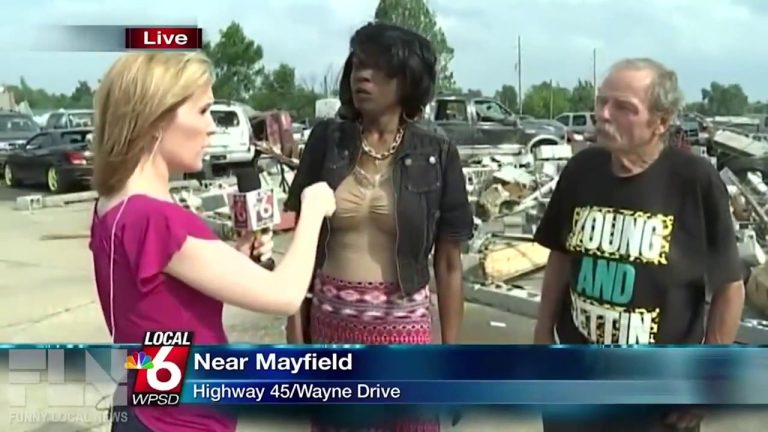 Reporter interviews two people near Mayfield debris site.