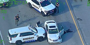 Police vehicles at highway accident scene