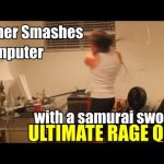 Gamer smashes computer with sword in frustration.