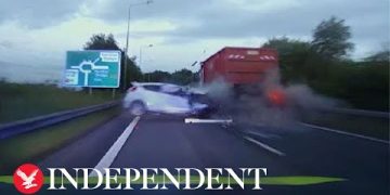 Car crash with truck on highway captured on dashcam.