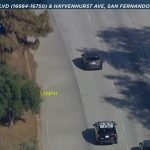 Aerial view of highway police pursuit.