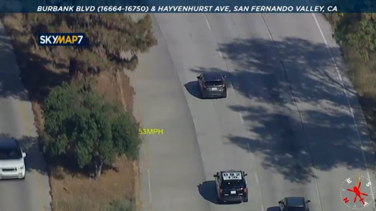 Aerial view of highway police pursuit.