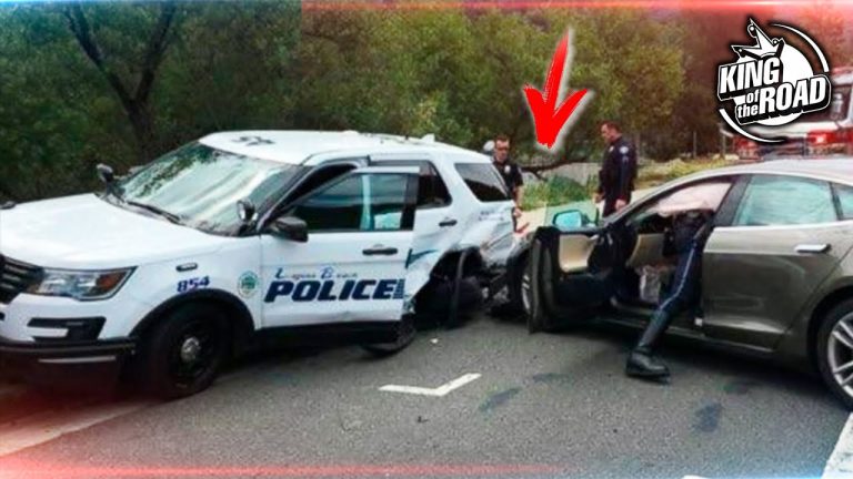 Police vehicle and car involved in accident scene.