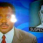 News anchor reporting suspect search on television broadcast.