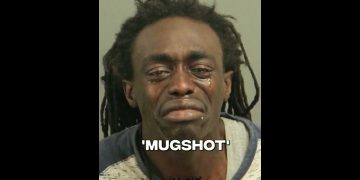 Person crying in a mugshot photo