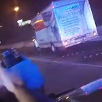 Police chase involving a moving truck at night