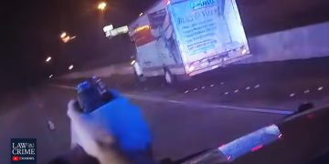 Police chase involving a moving truck at night