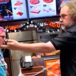 Argument between two people in a pizza shop