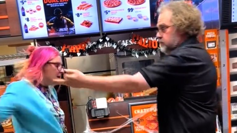 Argument between two people in a pizza shop