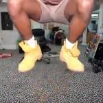 Person jumping indoors with boots on carpet