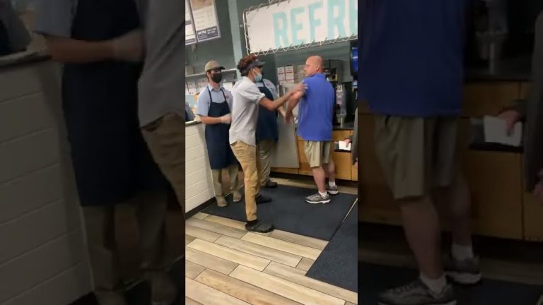 Workers assist customer at service counter