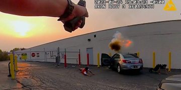 Police bodycam footage of vehicle explosion incident.