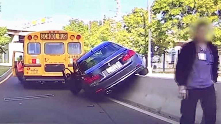 Car accident involving school bus and barrier.