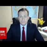 News interview interrupted by child entering room.