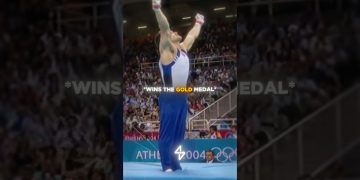 Gymnast celebrates winning Olympic gold medal.