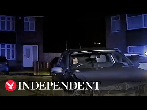 Car at night in residential street scene