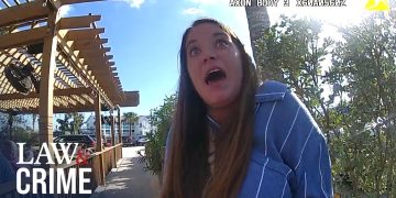 Shocked woman outdoors under wooden pergola