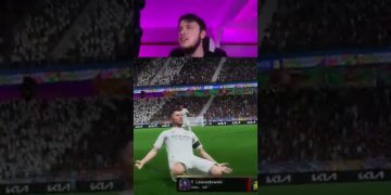 Gamer reacting to virtual soccer goal celebration.