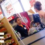 Customer talks to cashier in convenience store