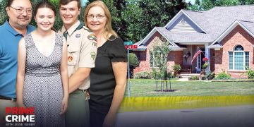 Family in front of a crime scene house