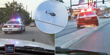 Police cars and helicopter in pursuit