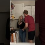 Two people arguing in a kitchen