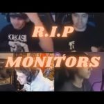 Four gamers playing intensely on monitors.