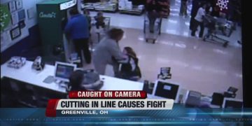 Store security camera captures a fight over line-cutting.