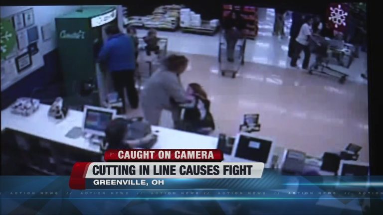 Store security camera captures a fight over line-cutting.