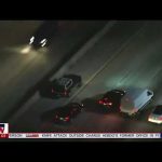 Aerial view of cars on highway at night.