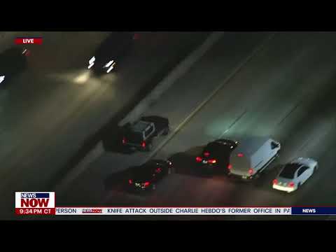 Aerial view of cars on highway at night.