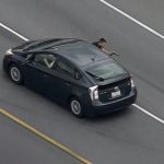 Highway police chase captured from above.