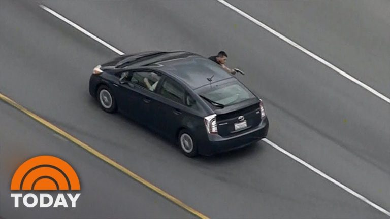 Highway police chase captured from above.