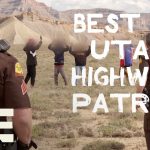 Utah State Troopers on patrol in desert landscape.