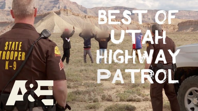 Utah State Troopers on patrol in desert landscape.