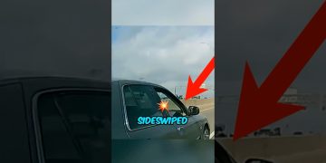 Car sideswiped on highway with arrow and text.