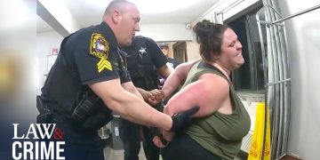 Police officer handcuffing person during arrest