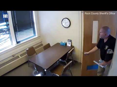 Man enters office with table and chairs.