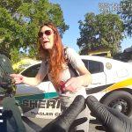 Police officer interacting with a woman roadside