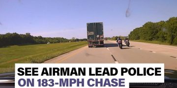 Motorcycles chase truck on highway at high speed.