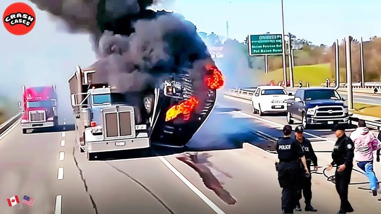 Truck fire on highway with police officers nearby