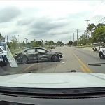 Police cars at crash scene on road